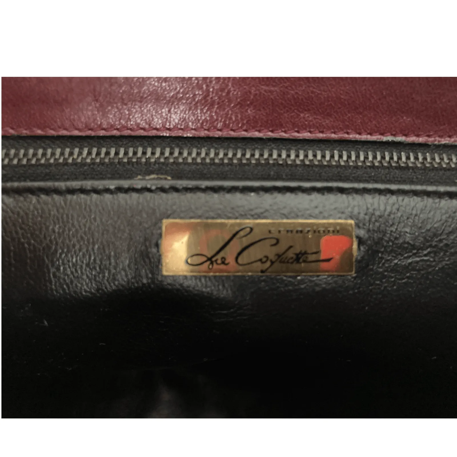 Le Cofuctte Leather Burgundy Clutch Bag