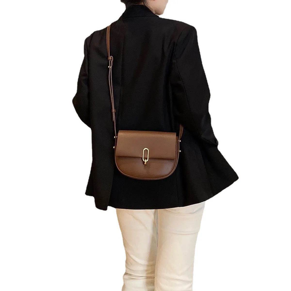 Modern Elegance: Niche Lock Cowhide Saddle Bag with Advanced Design Sense